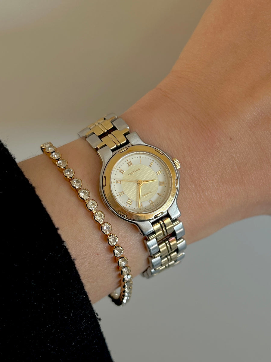 Two-tone Seiko Exceline watch worn on wrist with bracelet