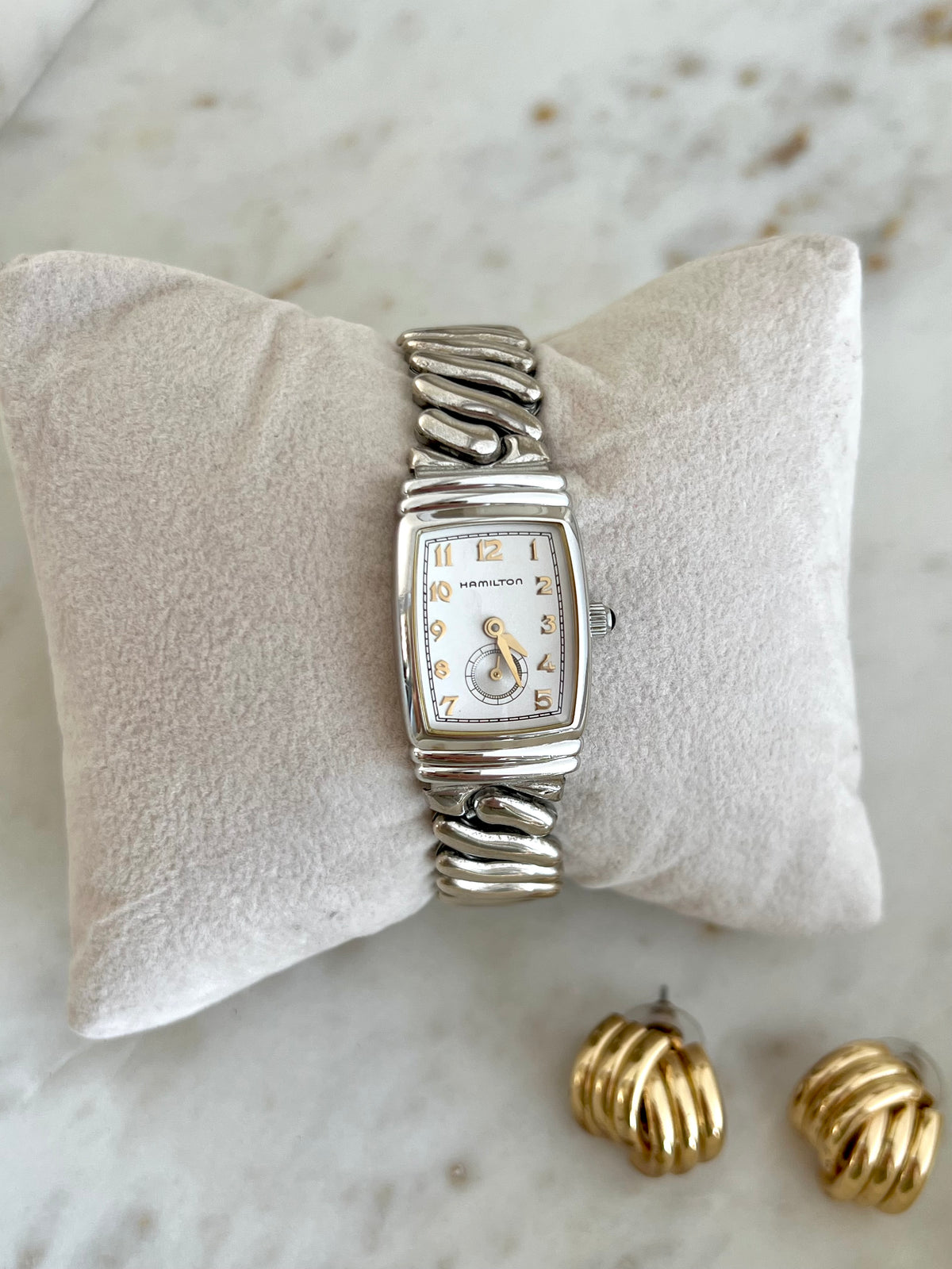 Hamilton Benton Silver Sculpted Watch: full front view on cushion.