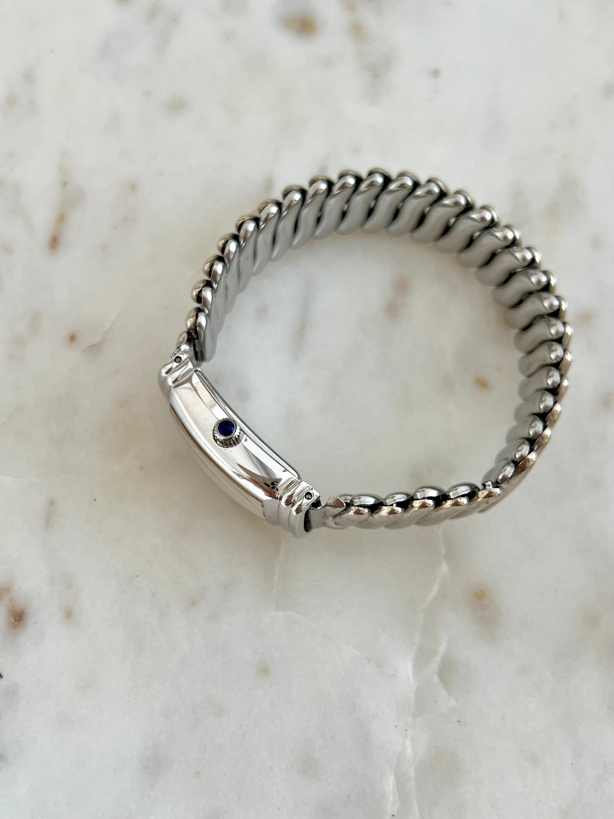 Hamilton Benton Silver Sculpted Watch: side profile showing blue crown accent.