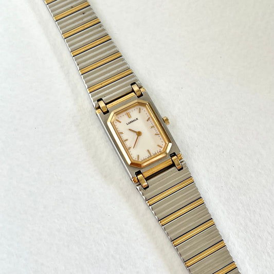 Lassale Wristwatch with gold and silver band on a white background