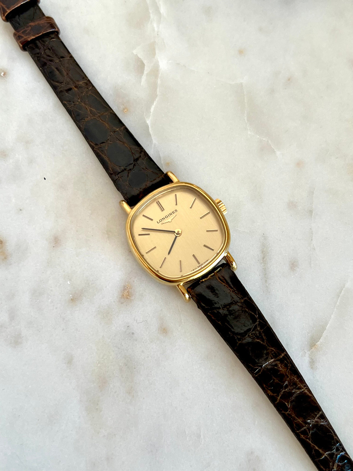 Vintage Longines womens gold tone square dress watch with champagne dial on brown leather strap