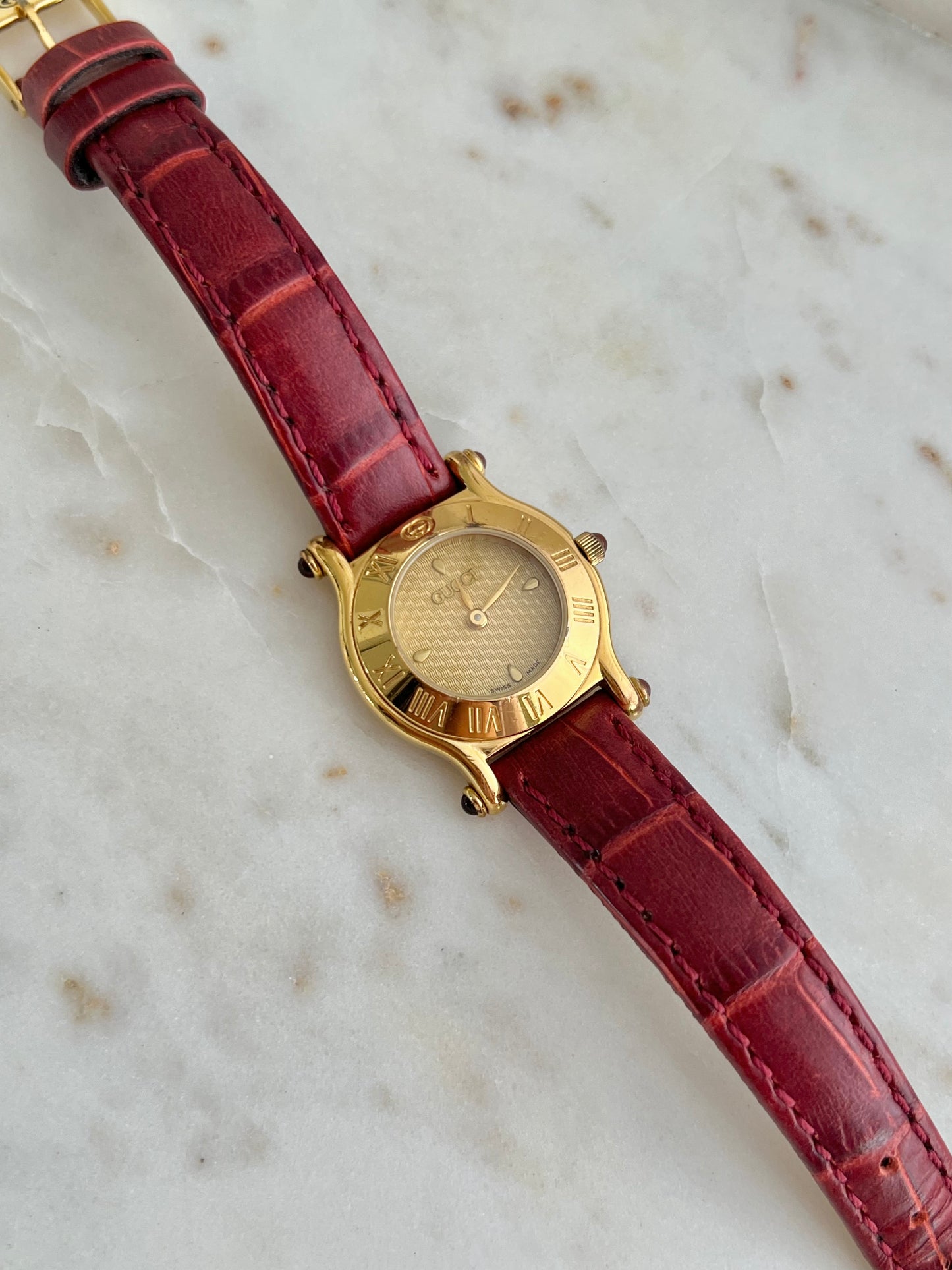 Gucci Gold Toned Ladies Watch with Roman Bezel and Textured Dial