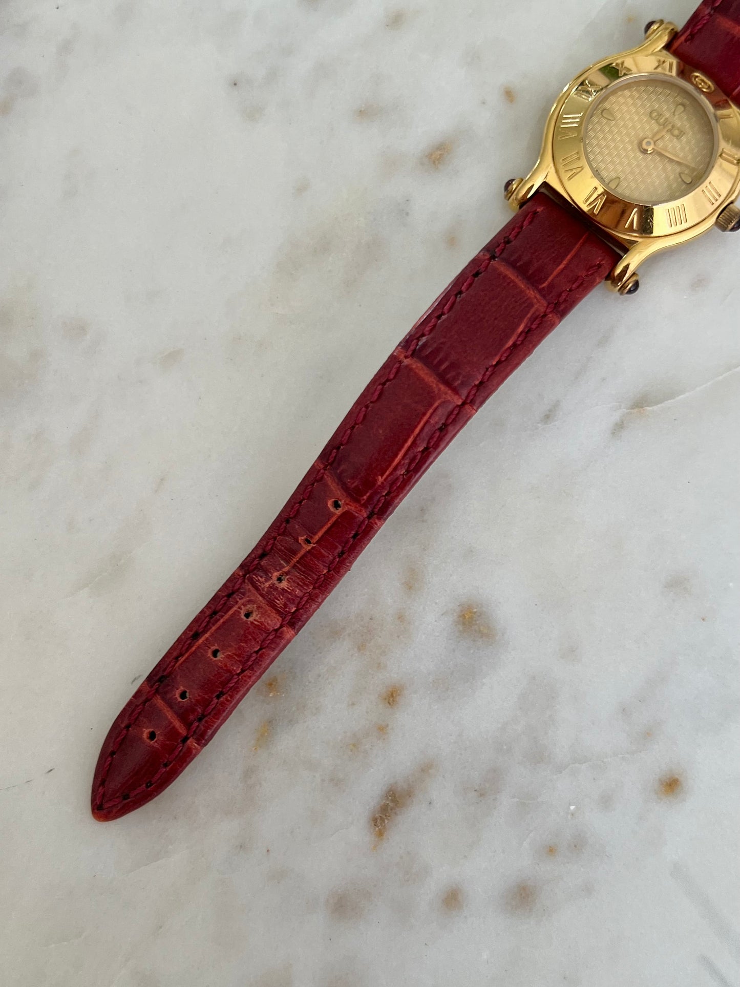 Gucci Gold Toned Ladies Watch with Roman Bezel and Textured Dial