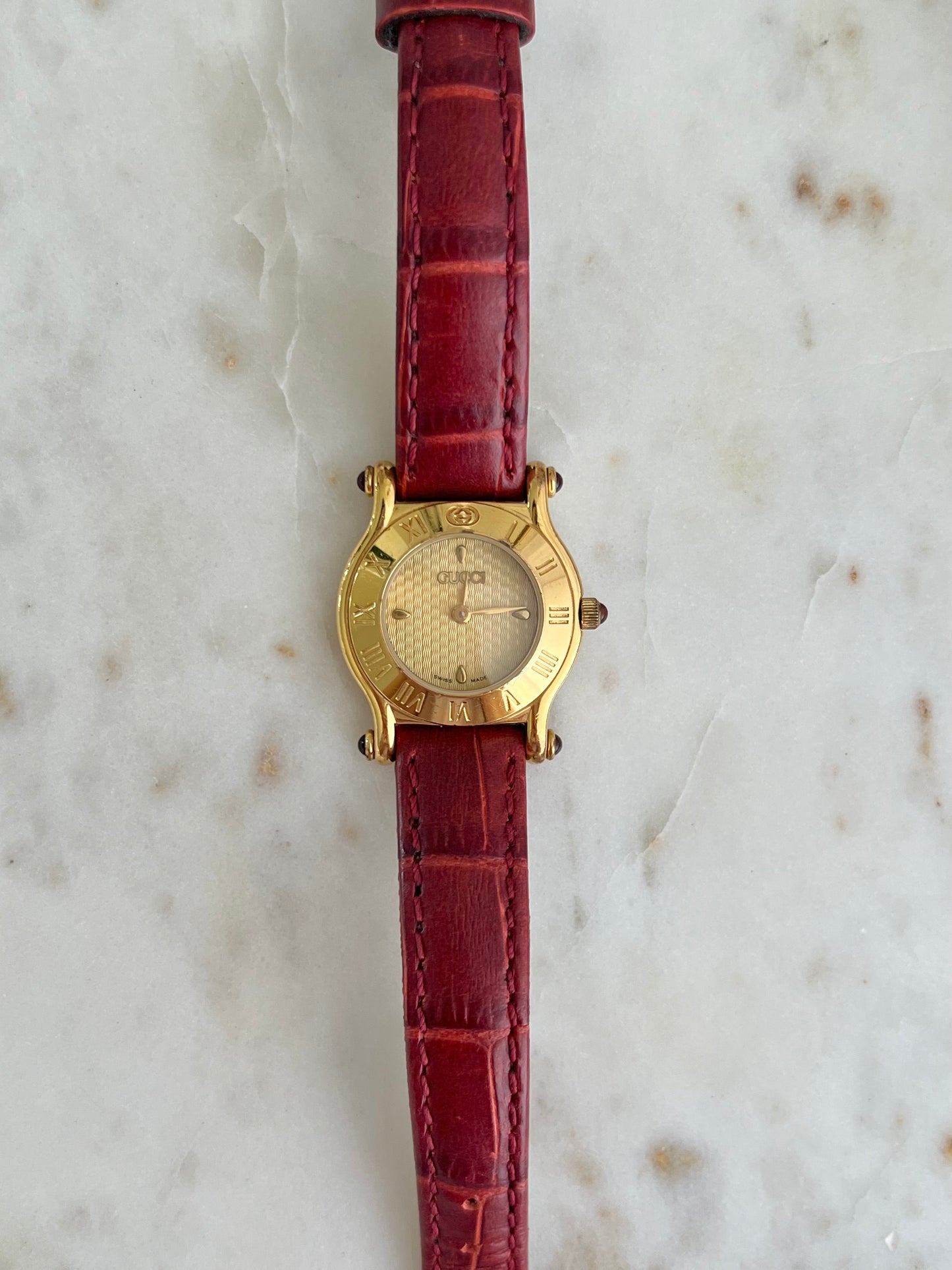 Gucci Gold Toned Ladies Watch with Roman Bezel and Textured Dial