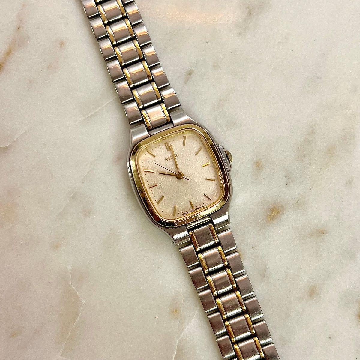 Two-tone Seiko Women's watch on a marble surface in NZ