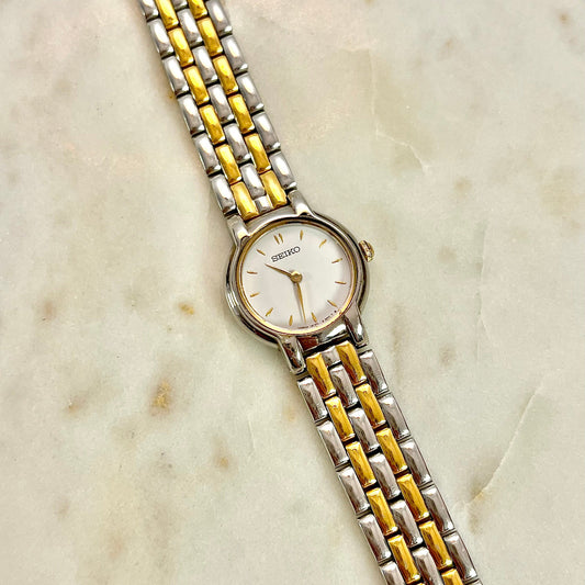 Two-tone Seiko women's watch on a marble surface