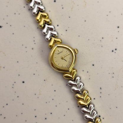 Seiko Gold and silver watch with a patterned background