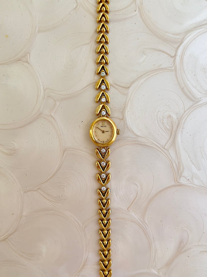 Seiko Ladies Gold Tennis Bracelet Watch with Diamond Accents and Champagne Dial