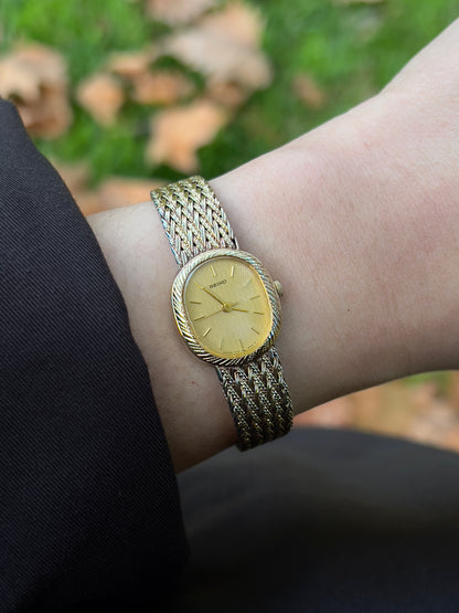 Seiko Gold Toned Oval Watch with a Wreath Textured Case
