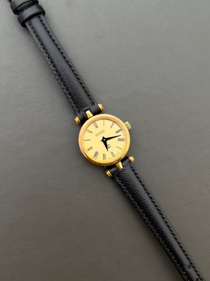 Gucci Sherry Ladies Gold Roman Dial Watch in Gold with Black Strap