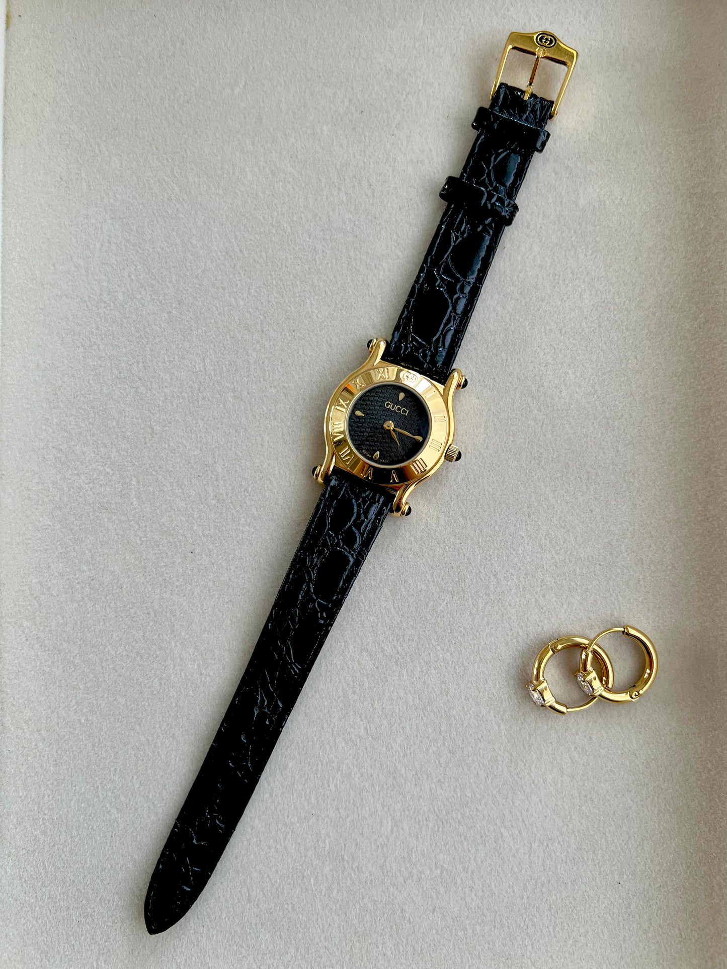 Gucci Gold Toned Ladies Watch with Roman Bezel and Textured Dial