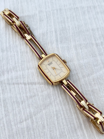 Seiko Ladies Gold Bracelet Watch with Crimson Enamel Accents