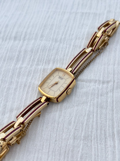 Seiko Ladies Gold Bracelet Watch with Crimson Enamel Accents