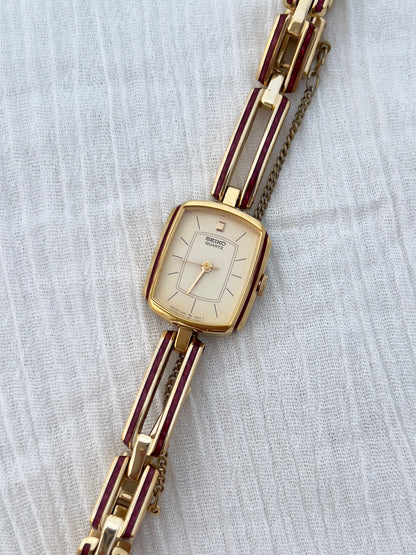 Seiko Ladies Gold Bracelet Watch with Crimson Enamel Accents