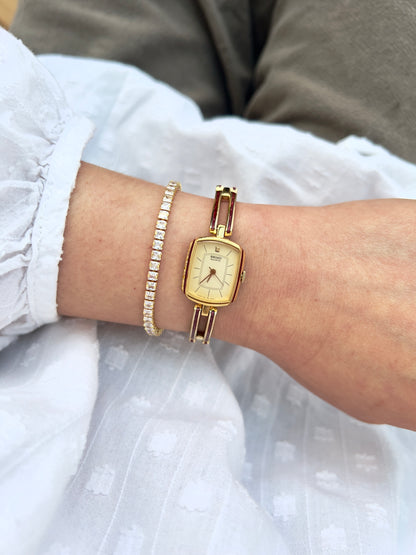 Seiko Ladies Gold Bracelet Watch with Crimson Enamel Accents