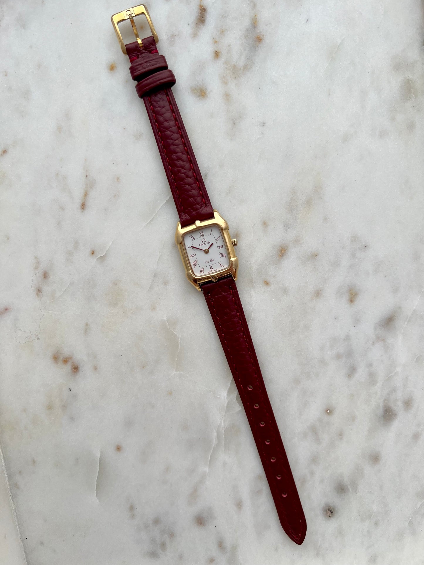 Omega De Ville Gold Women’s Watch with Burgundy Roman Numerals
