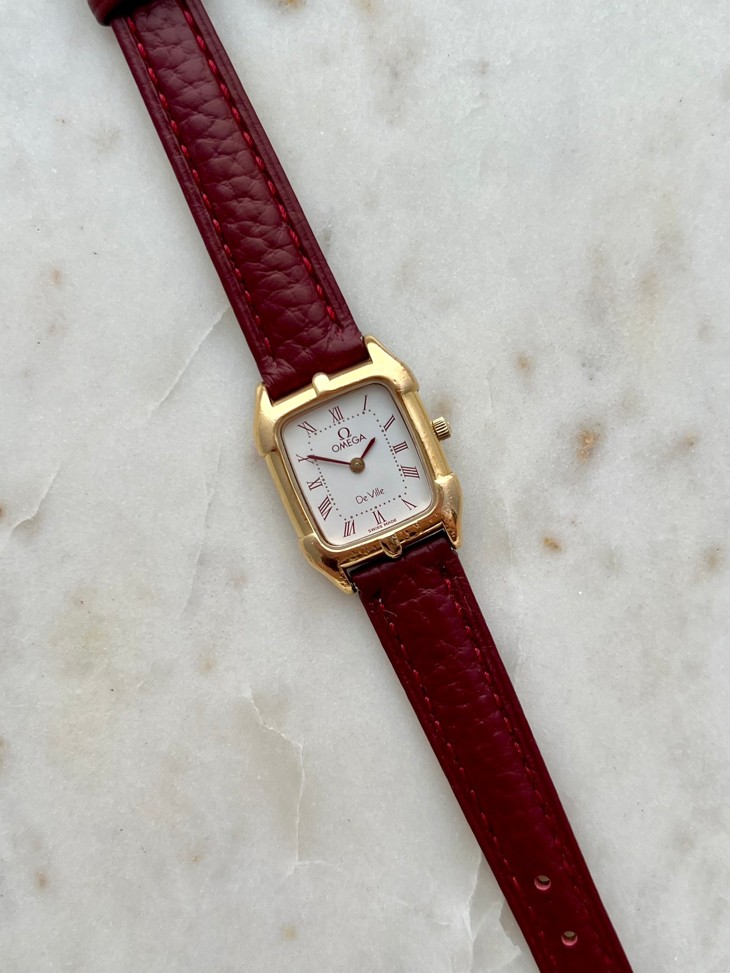 Omega De Ville Gold Women’s Watch with Burgundy Roman Numerals