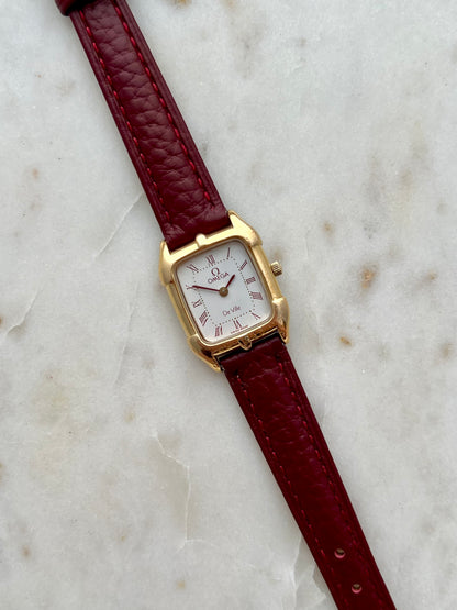 Omega De Ville Gold Women’s Watch with Burgundy Roman Numerals