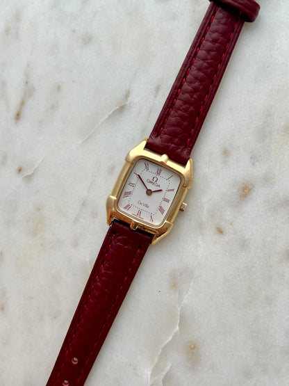 Omega De Ville Gold Women’s Watch with Burgundy Roman Numerals