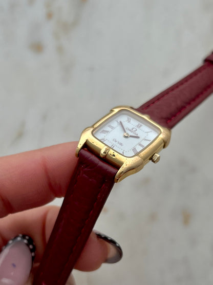 Omega De Ville Gold Women’s Watch with Burgundy Roman Numerals