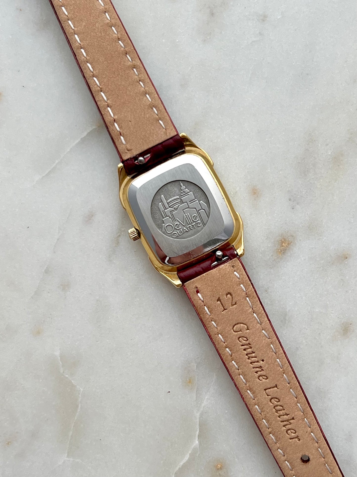 Omega De Ville Gold Women’s Watch with Burgundy Roman Numerals