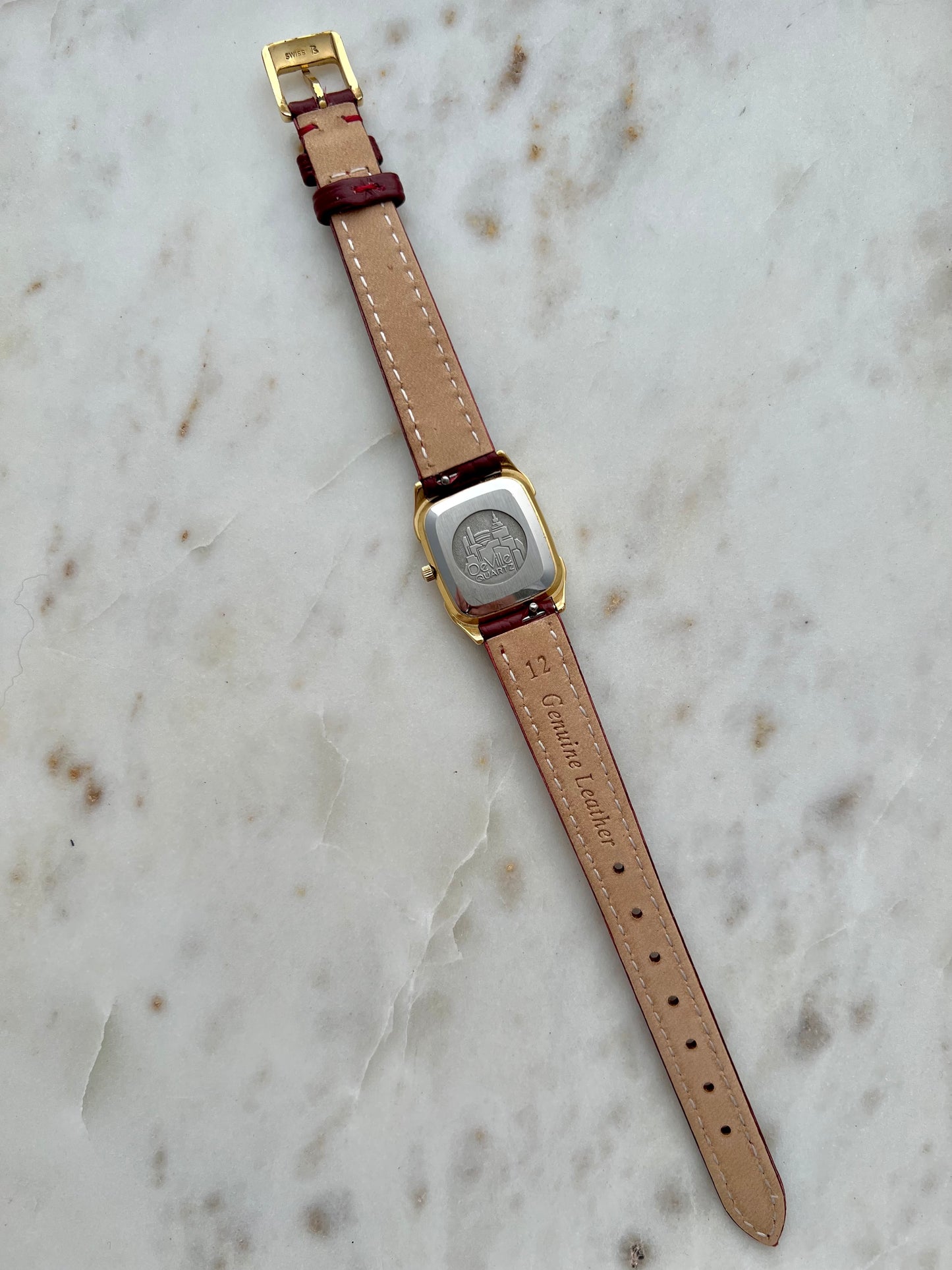 Omega De Ville Gold Women’s Watch with Burgundy Roman Numerals