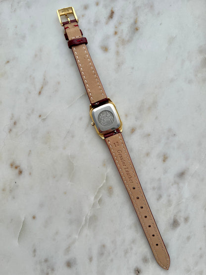 Omega De Ville Gold Women’s Watch with Burgundy Roman Numerals
