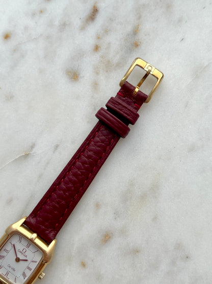 Omega De Ville Gold Women’s Watch with Burgundy Roman Numerals