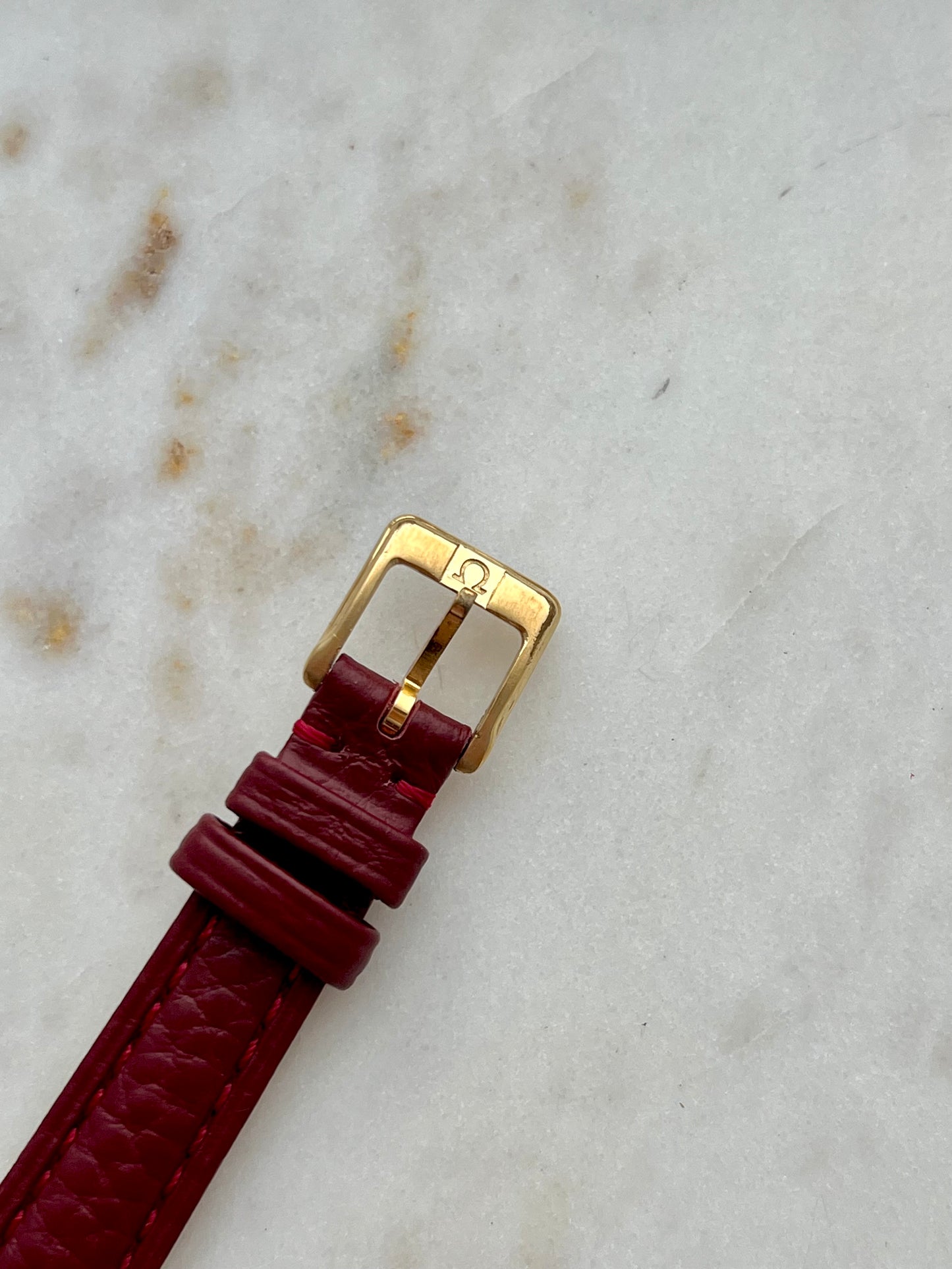 Omega De Ville Gold Women’s Watch with Burgundy Roman Numerals