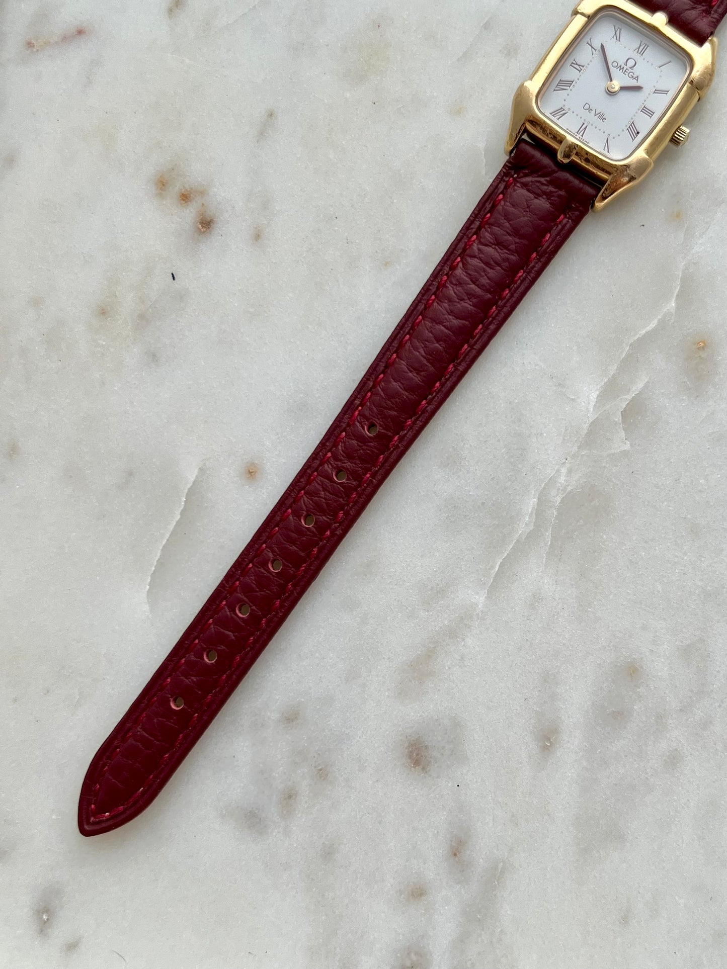 Omega De Ville Gold Women’s Watch with Burgundy Roman Numerals
