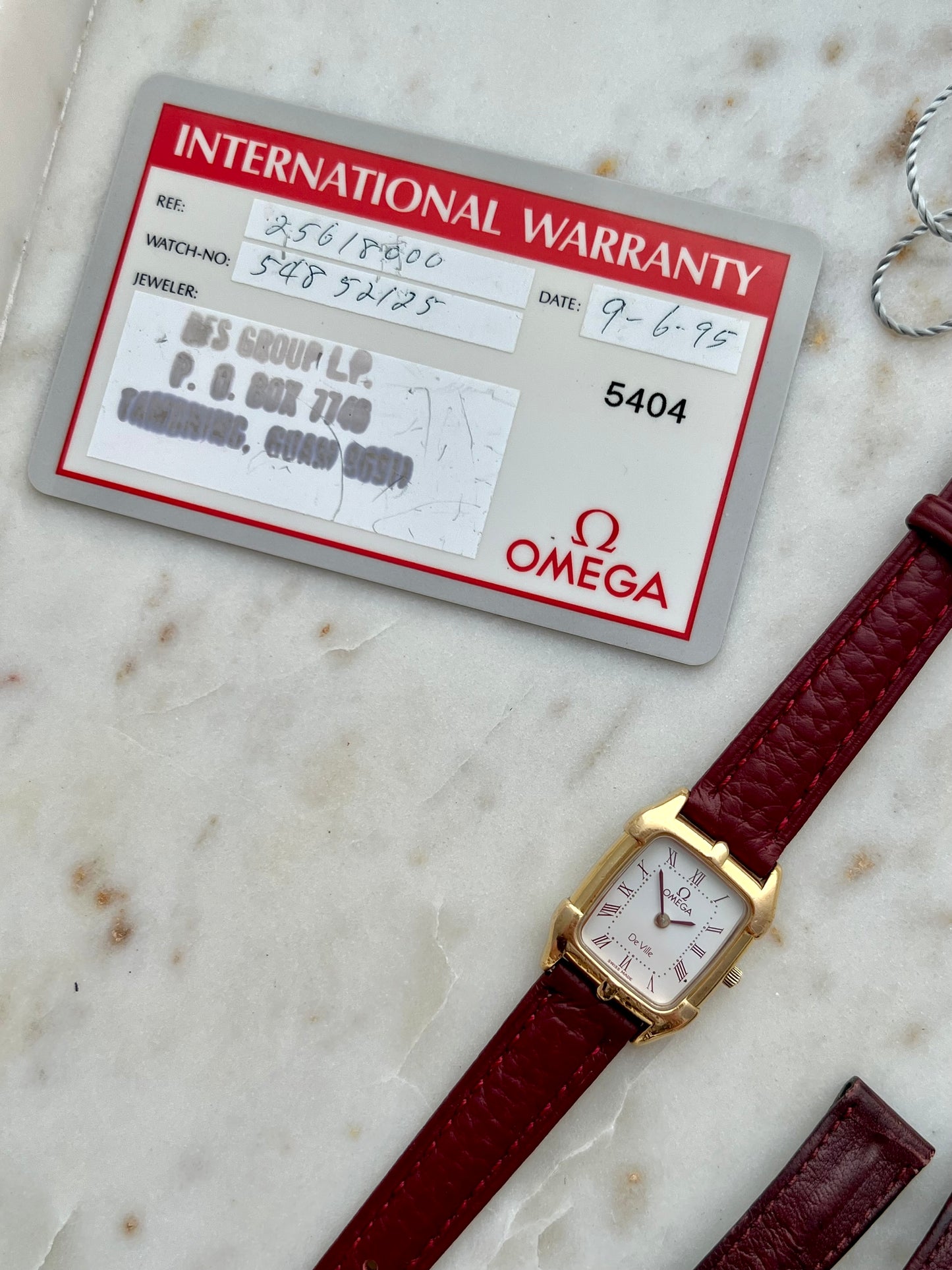 Omega De Ville Gold Women’s Watch with Burgundy Roman Numerals