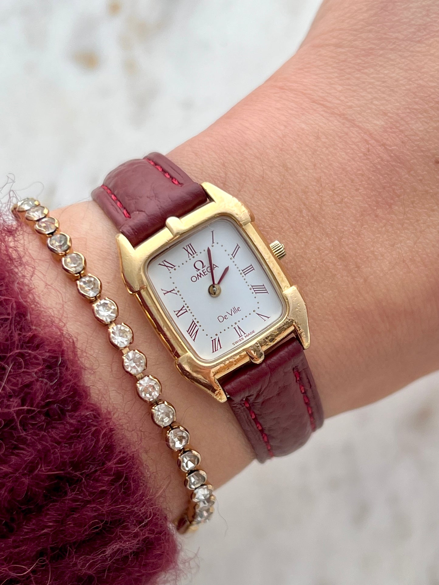 Omega De Ville Gold Women’s Watch with Burgundy Roman Numerals