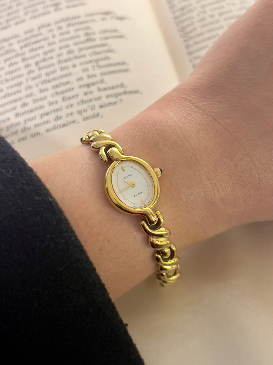 Gold Seiko Exceline bracelet watch worn on the wrist