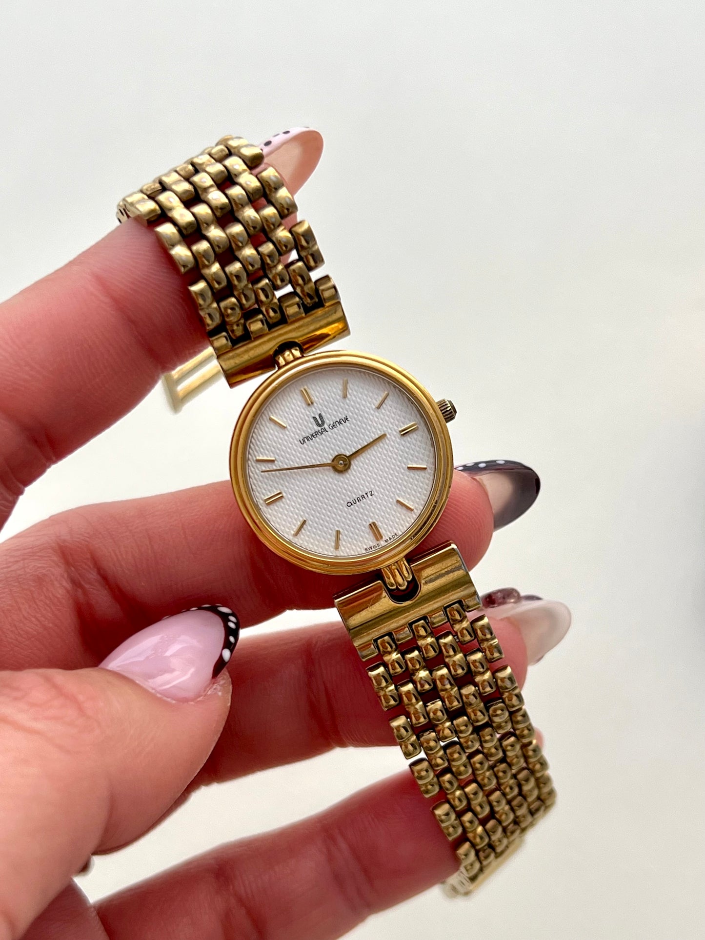 Universal Geneve Gold Bracelet Women’s Watch with Textured Dial