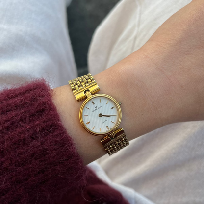 Universal Geneve Gold Bracelet Women’s Watch with Textured Dial
