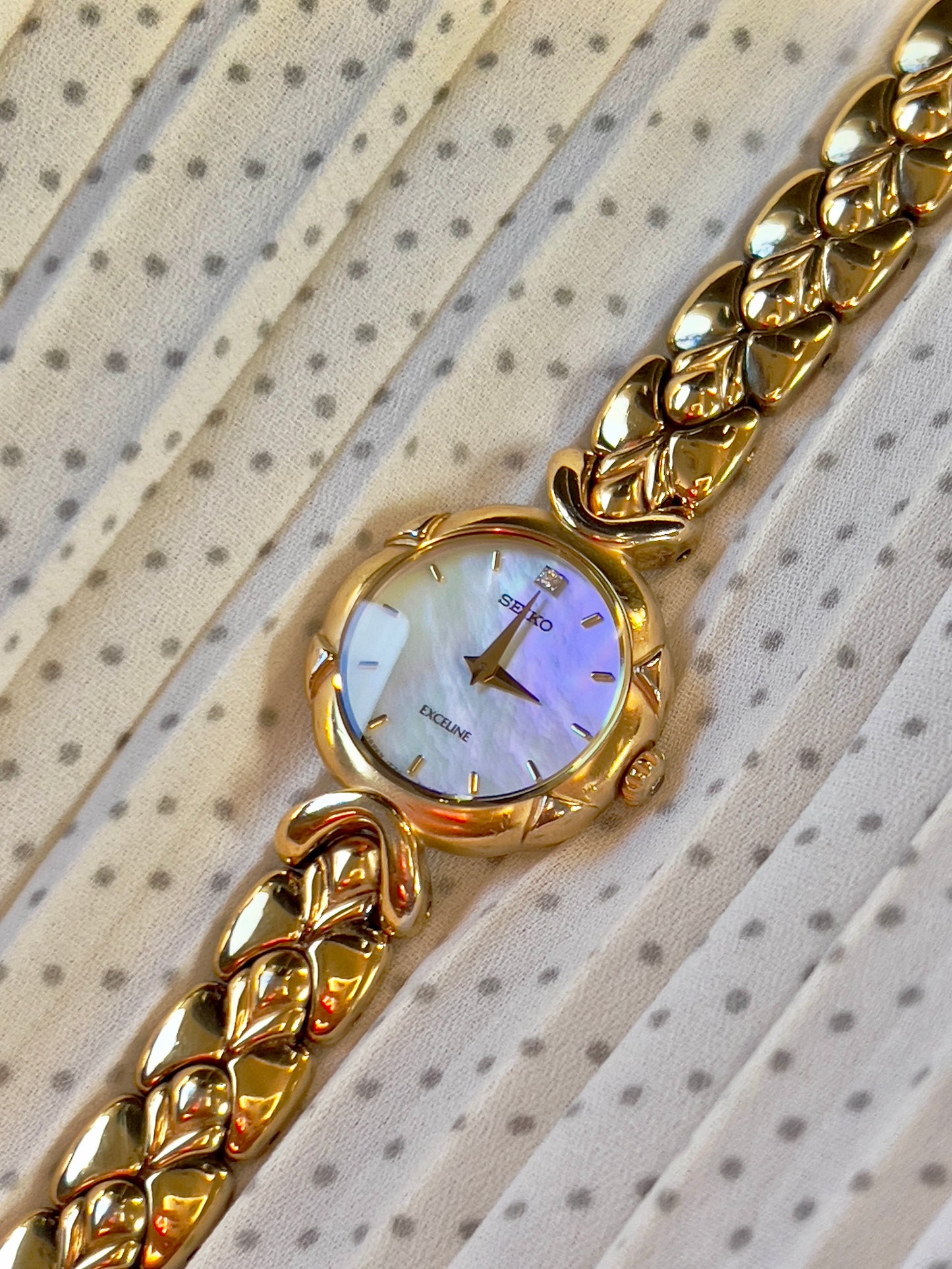 Seiko Exceline Gold Toned Woman's Watch with Radiant Mother of Pearl Dial