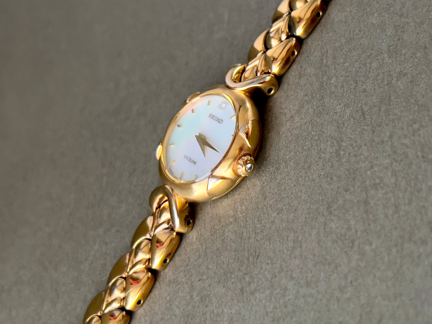 Seiko Exceline Gold Toned Woman's Watch with Radiant Mother of Pearl Dial
