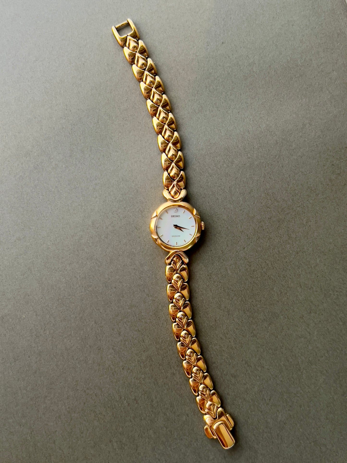 Seiko Exceline Gold Toned Woman's Watch with Radiant Mother of Pearl Dial