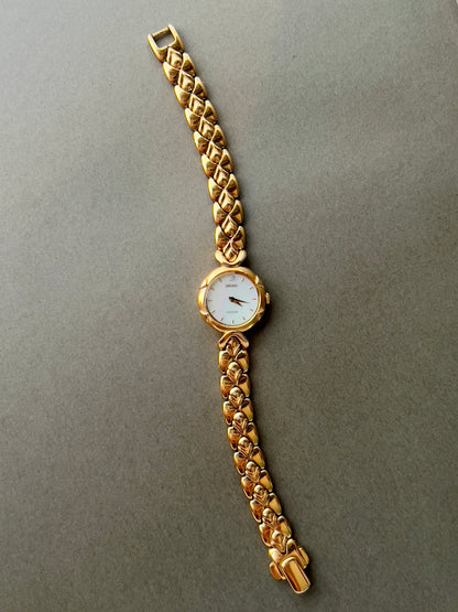 Seiko Exceline Gold Toned Woman's Watch with Radiant Mother of Pearl Dial
