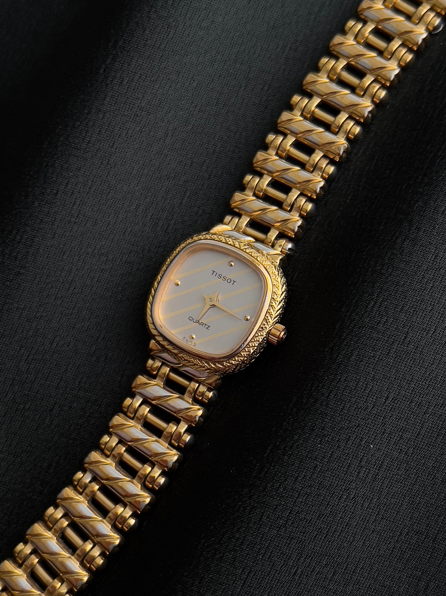 Tissot Ladies Gold Watch with Textured Bracelet and Striped Dial