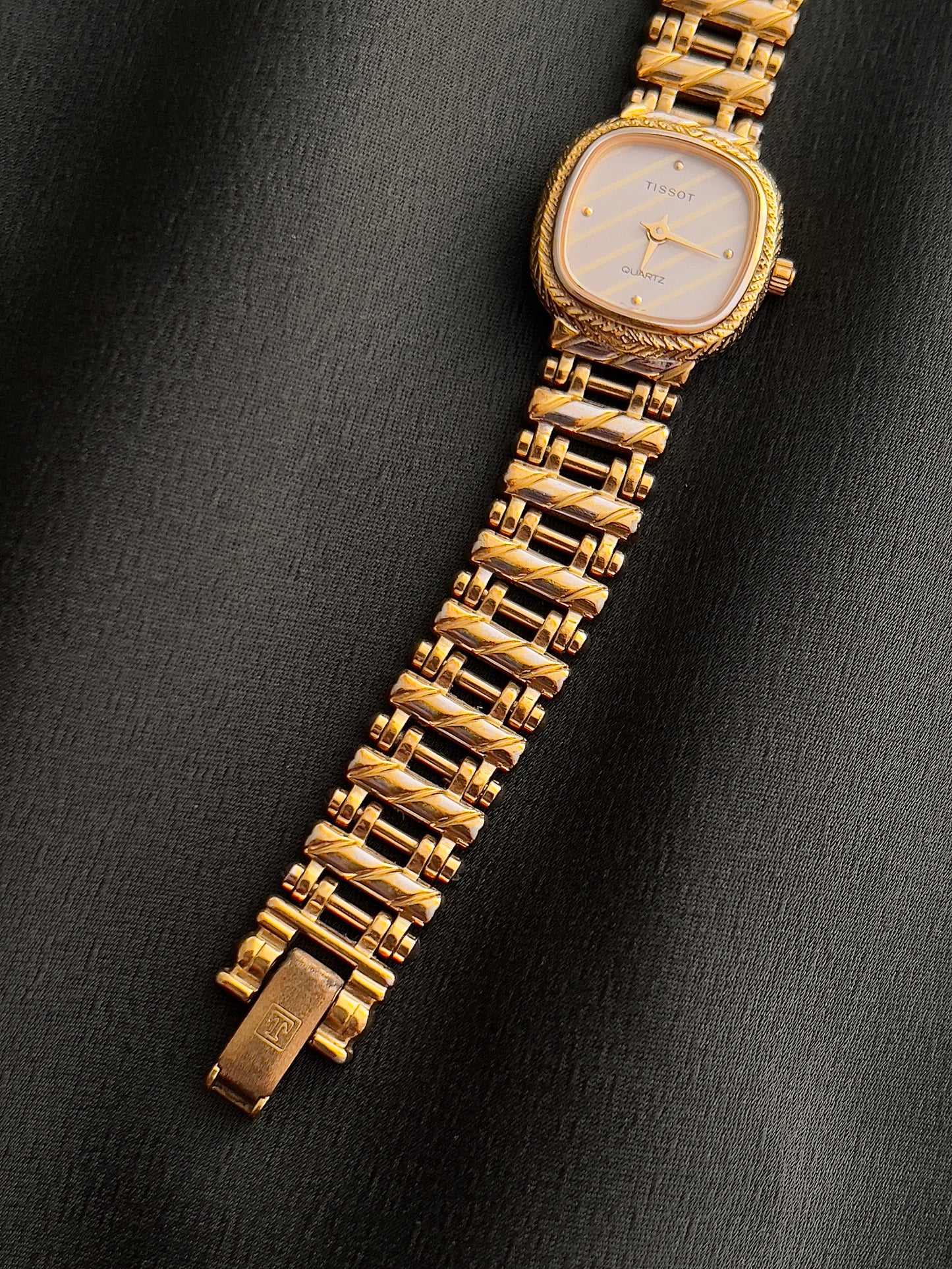 Tissot Ladies Gold Watch with Textured Bracelet and Striped Dial