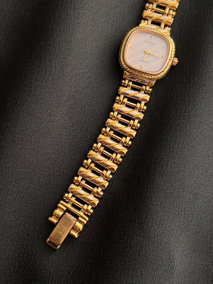 Tissot Ladies Gold Watch with Textured Bracelet and Striped Dial