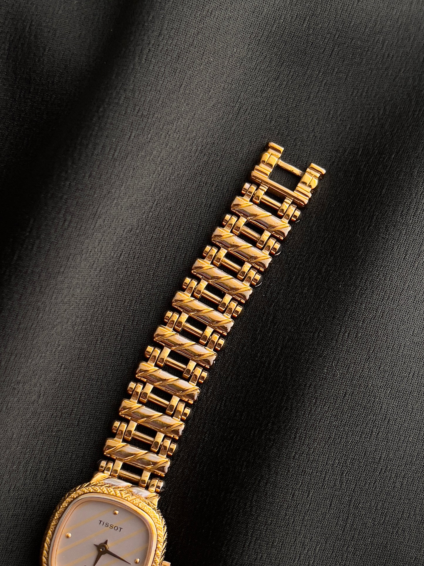 Tissot Ladies Gold Watch with Textured Bracelet and Striped Dial