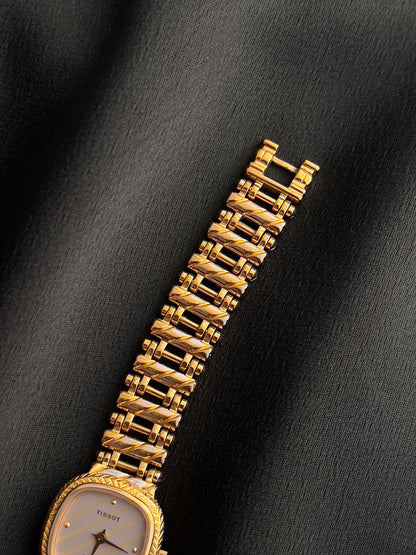 Tissot Ladies Gold Watch with Textured Bracelet and Striped Dial