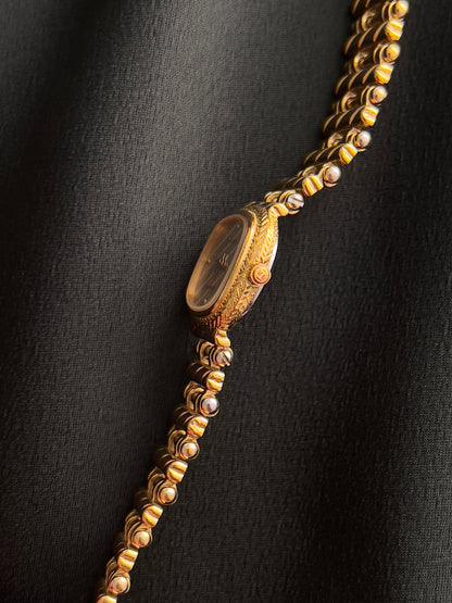 Tissot Ladies Gold Watch with Textured Bracelet and Striped Dial