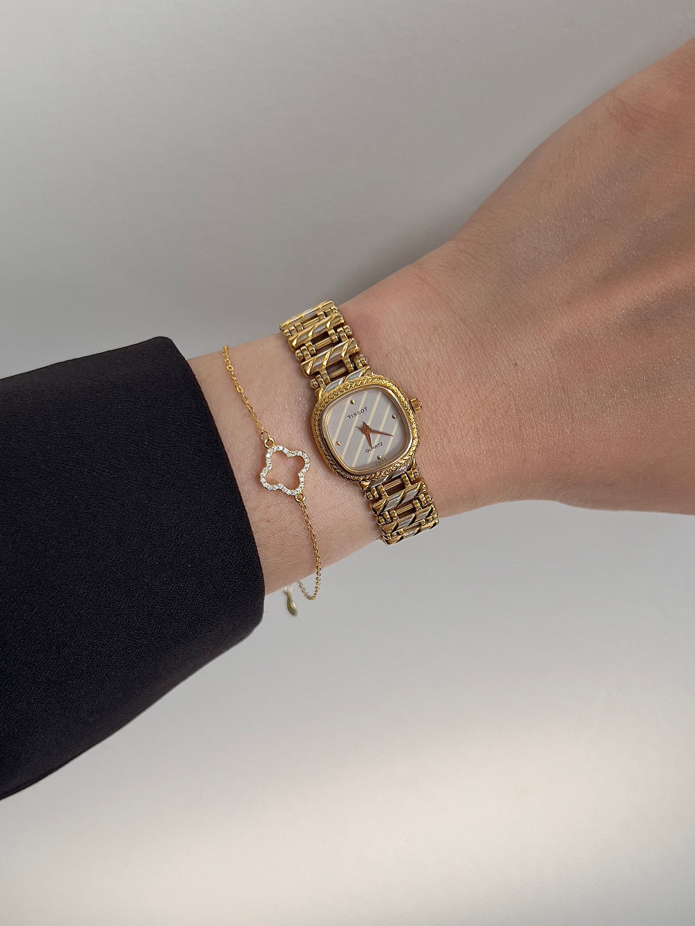 Tissot Ladies Gold Watch with Textured Bracelet and Striped Dial