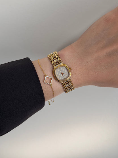 Tissot Ladies Gold Watch with Textured Bracelet and Striped Dial