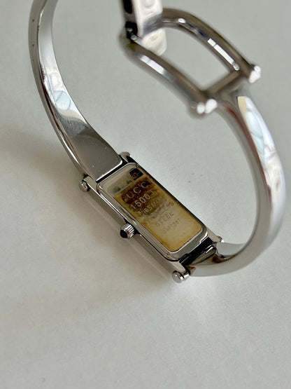 Gucci 1500L Silver Bangle Women's Watch Black Dial, case profile of a vintage women's watch at Gilded Hour.