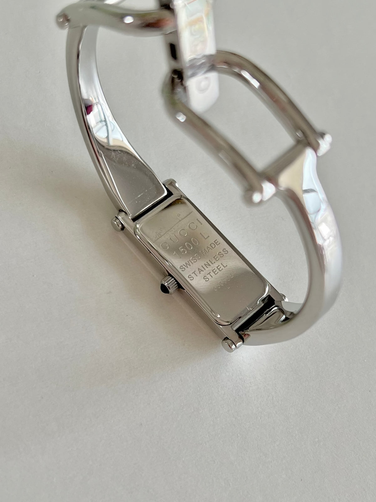 Gucci 1500L Silver Bangle Women's Watch Black Dial (Small), bracelet detail of a vintage women's watch at Gilded Hour.