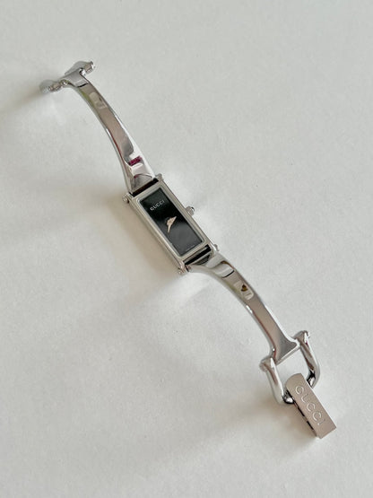 Gucci 1500L Silver Bangle Women's Watch Black Dial (Small), caseback detail of a vintage women's watch at Gilded Hour.